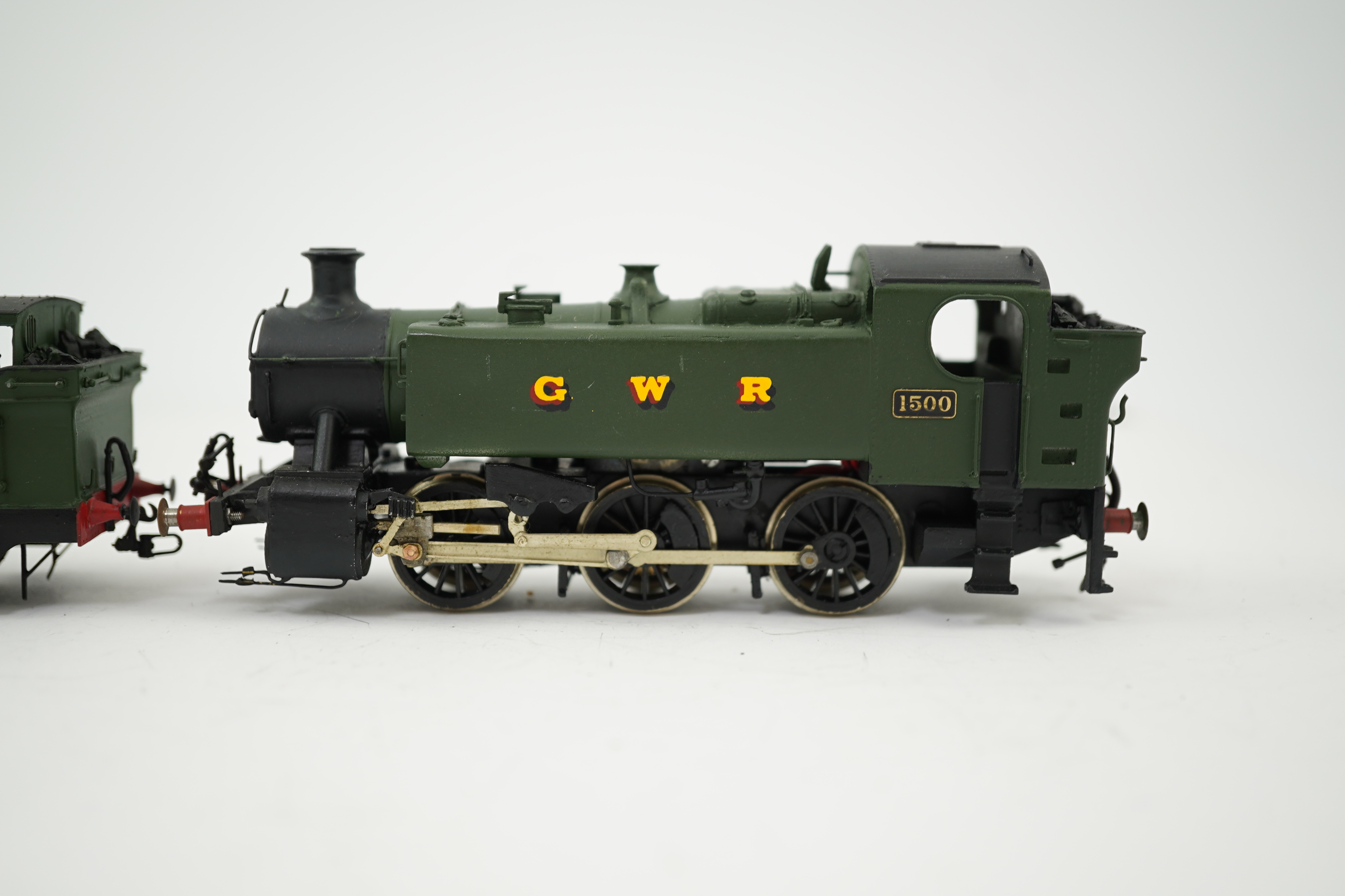 Three 00 gauge brass and white metal kit built GWR tank locomotives; a 15xx class 0-6-0T, 1500, together with an 54xx class 0-6-0PT, 5406, and a 19xx class 0-6-0PT, 1925, all constructed, painted and lined to a high stan
